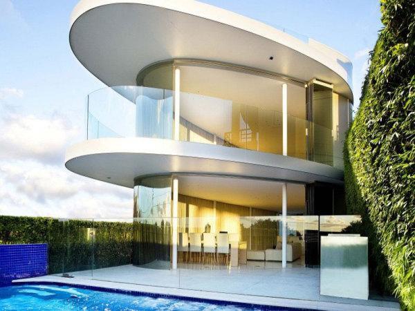 modern house with grall balconies and swimming pool