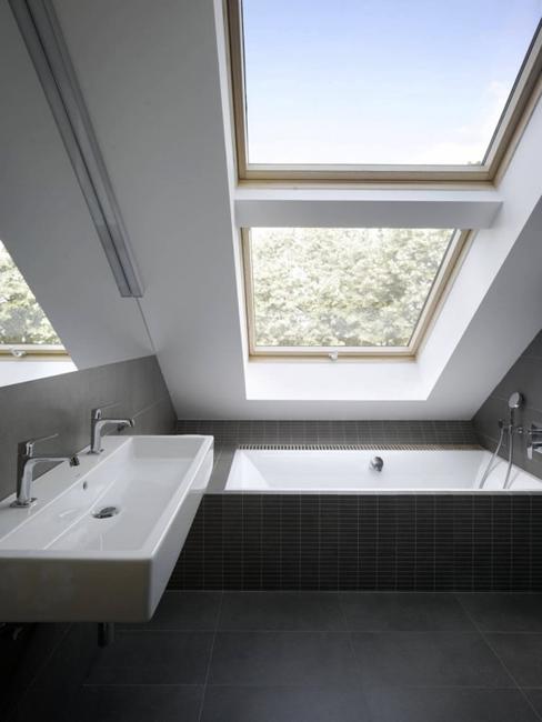 small bathroom design with inclined roof window