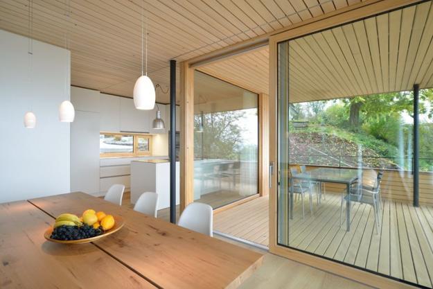 Bright Home Interiors Blending Light Wood and Glass into Modern