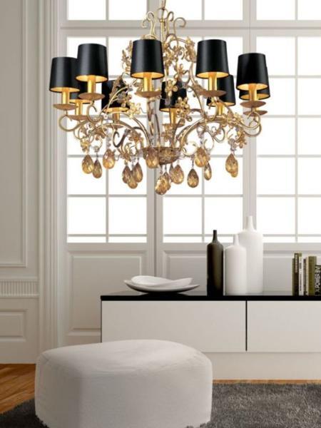 black and white room decor with large chandelier and black lamp shades