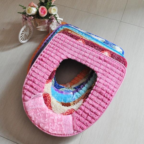 soft fabric toilet seat pads in various colors and designs