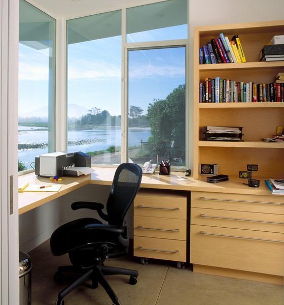 A Modern Home Office Setup with Computer on Desk with a Window