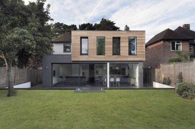 old house extension with glass addition in contemporary style