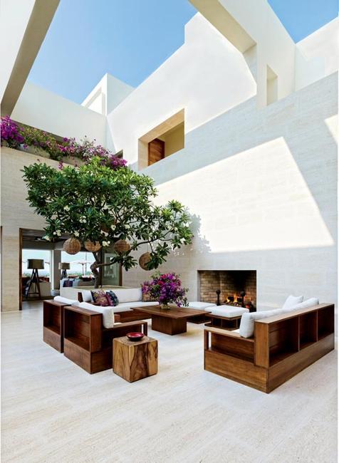 beautiful fireplaces built with stone in outdoor rooms