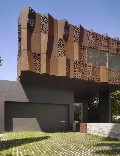 modern house exterior walls with perforated screen made of steel