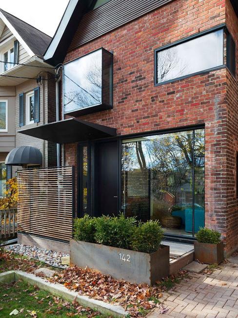house exterior redesign, vintage brick walls and large windows