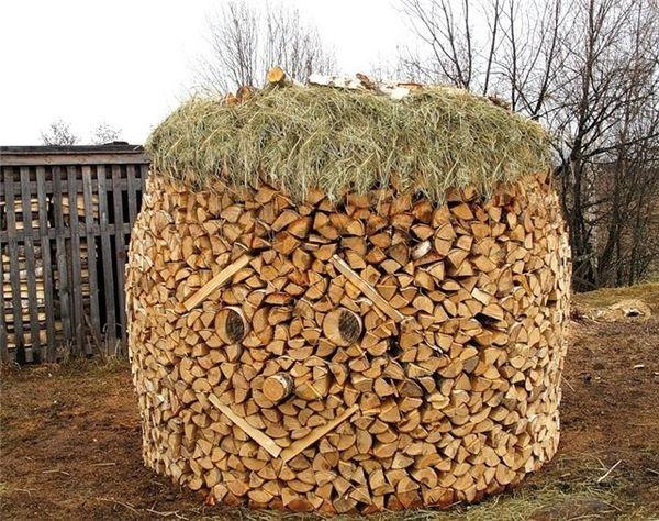 stacking wood logs and making unique designs for yard decorating