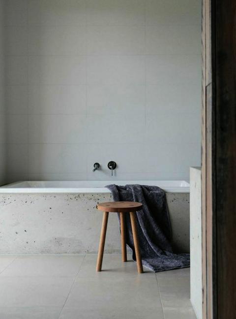 modern bathroom design and bathtub built around finish materials