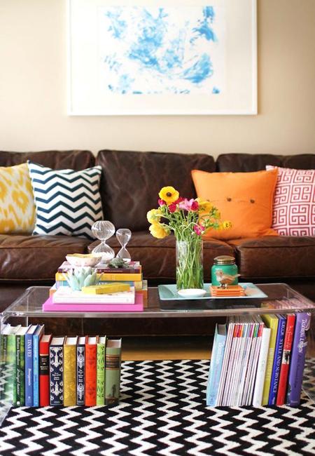 living room decorating with colorful pillows and books