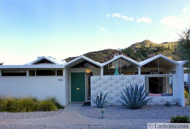 mid century modern house exterior with large windows