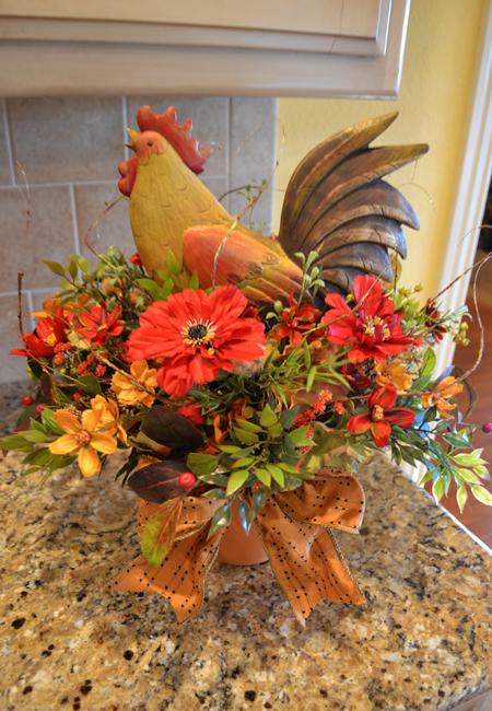 Flower Arrangements and Rooster Accents Creating Bold, Jazzy Table