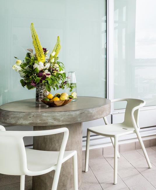 concrete dining table with floral centerpiece