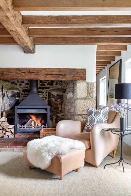 living room design with fireplace and exposed ceiling beams