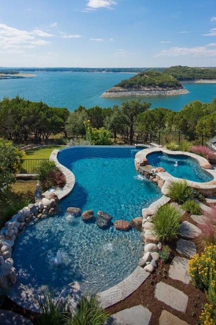 pool with shallow end and fountain