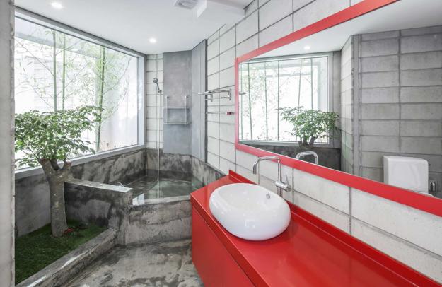 modern bathroom design with red sink vanity