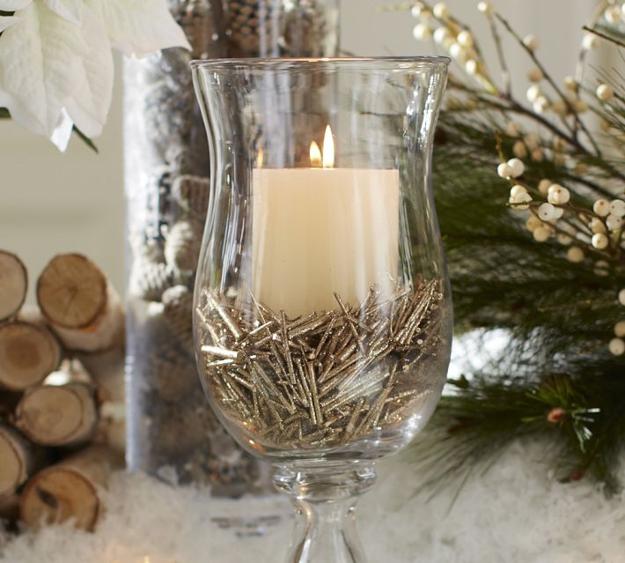 nails and candle in glass centerpiece idea