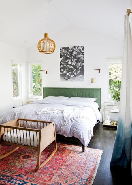 bed with green headboard