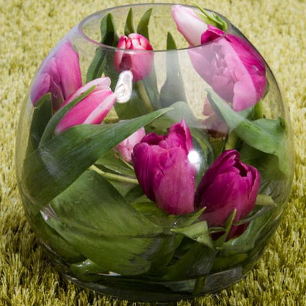 glass vase with floating tulips