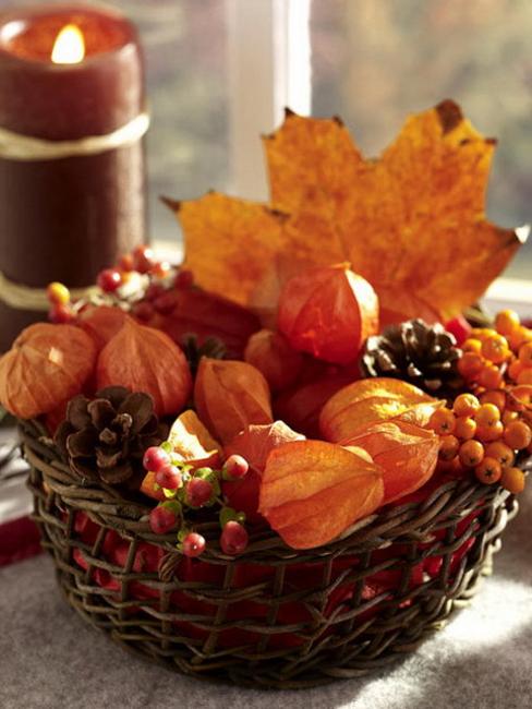 basket with autumn leaves and berries