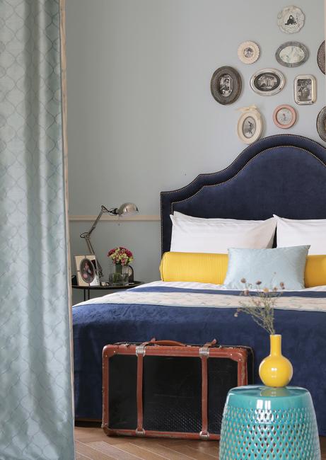 dark blue upholstered bed