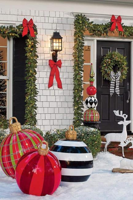 Outdoor Christmas Decorating with Green Garlands and Winter Holiday Wreaths