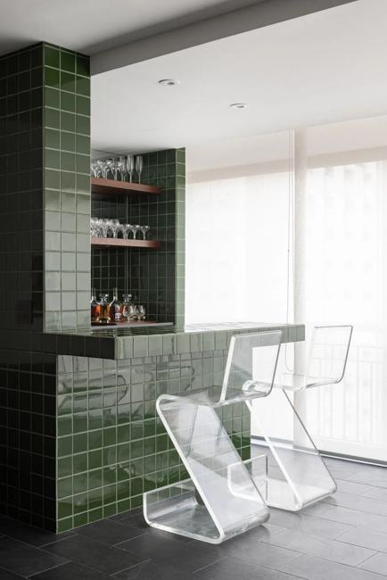 green wall tiles plastic chairs
