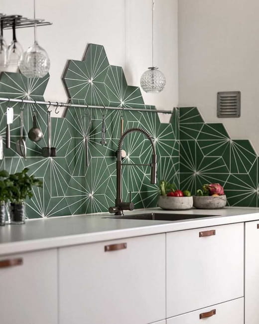 green wall tiles white kitchen cabinets