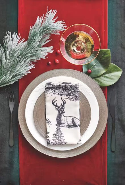 green leaves pine branches neutral colors table setting