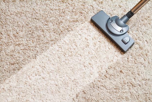 vacuuming carpets