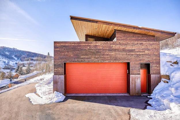 contemporary garage red door sloped roof