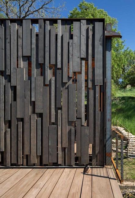 unusual fence design dark color
