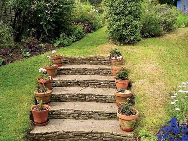 stone staircase decorated pots flowers