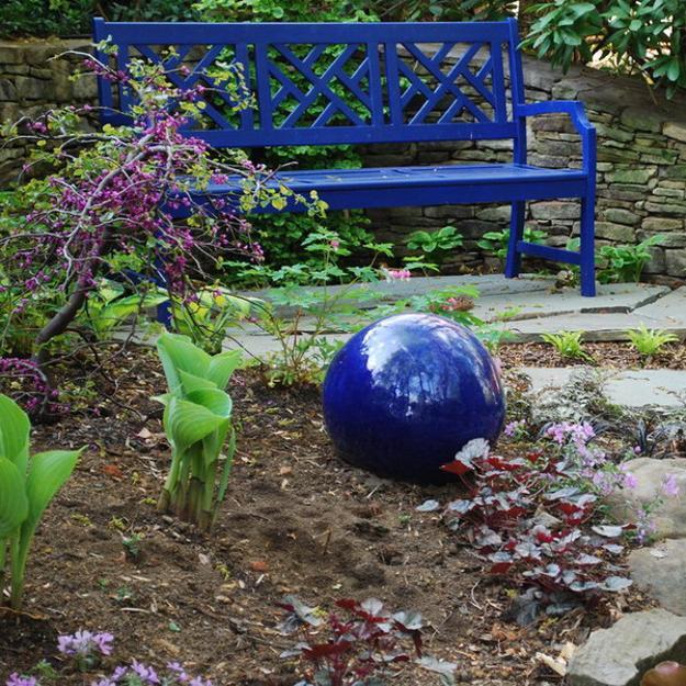 garden art shrubs bench