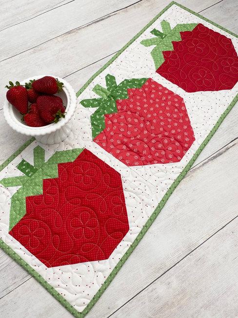 red white table setting strawberry accents