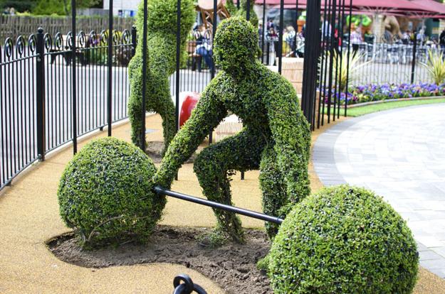 weightlifting garden sculpture