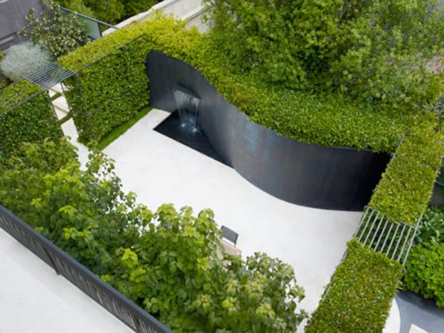 curvy wall fountain outdoor patio ideas